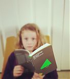 A young reader with How To Change The World