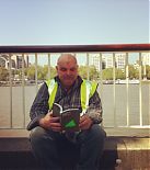 Reading How To Change The World in lunchhour at London's Southbank